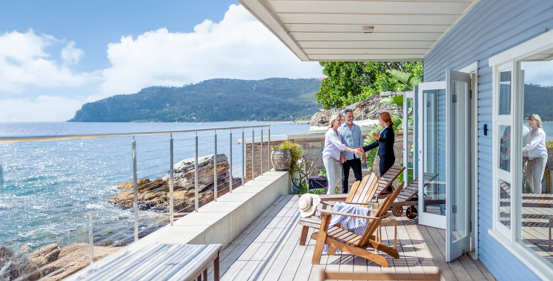 Couple Shaking Hands at Beach House